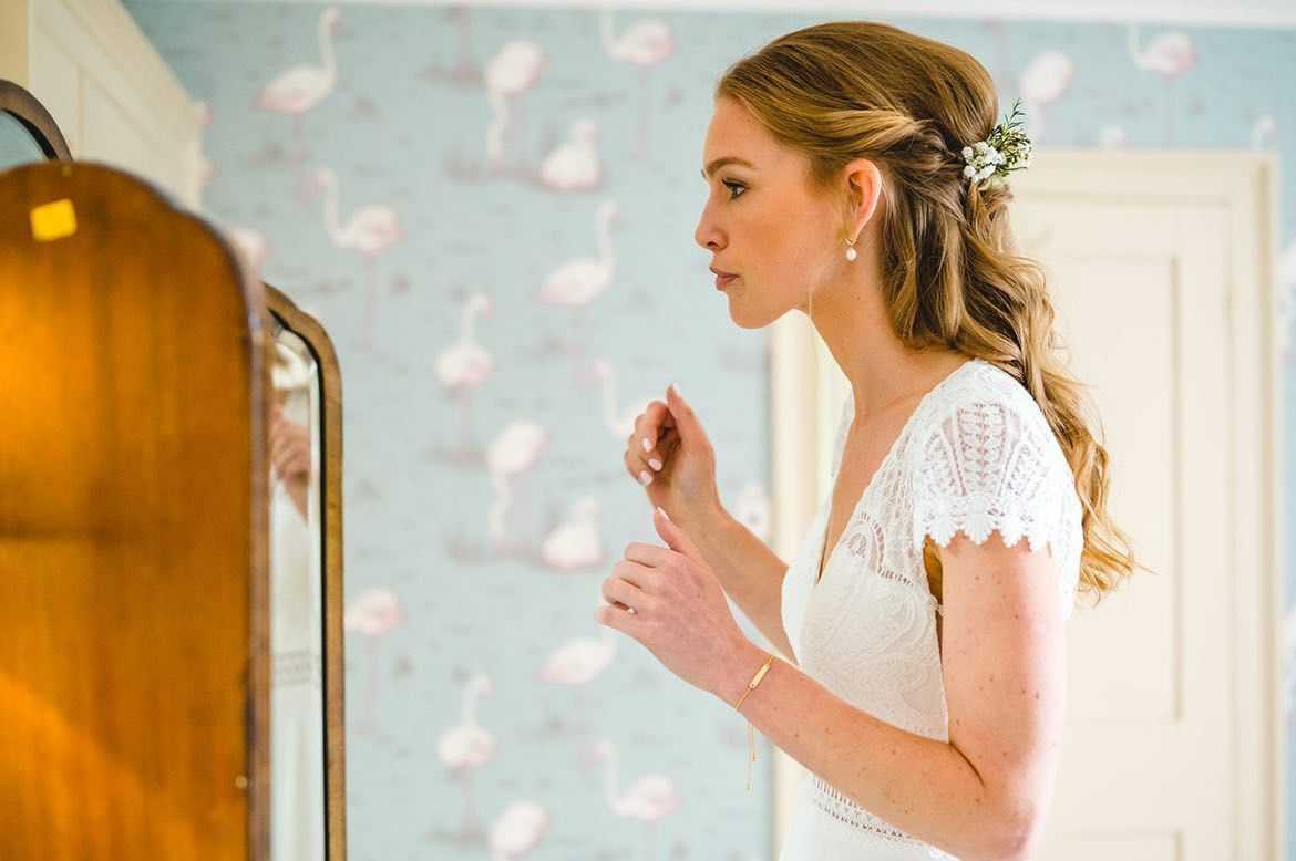 bride looking in mirror